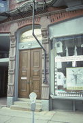 725-729 N MILWAUKEE ST, a Queen Anne retail building, built in Milwaukee, Wisconsin in 1881.