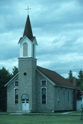 COUNTY HIGHWAY B/E ON SE SIDE OF HAYWARD, HISTORYLAND, OLD HAYWARD, a Front Gabled house of worship, built in Hayward, Wisconsin in 1897.