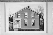 910 S 3RD ST, a Greek Revival house, built in Milwaukee, Wisconsin in 1854.