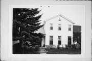 1209-1211 S 7TH ST, a Greek Revival house, built in Milwaukee, Wisconsin in 1860.