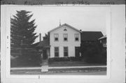 1209-1211 S 7TH ST, a Greek Revival house, built in Milwaukee, Wisconsin in 1860.