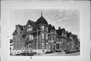 903-919 N 14TH ST, a Dutch Colonial Revival row house, built in Milwaukee, Wisconsin in 1897.