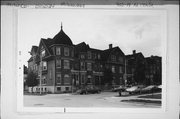 903-919 N 14TH ST, a Dutch Colonial Revival row house, built in Milwaukee, Wisconsin in 1897.