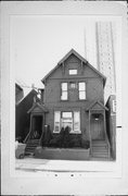 1235-1237 E BRADY ST, a Queen Anne duplex, built in Milwaukee, Wisconsin in 1881.