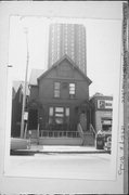 1235-1237 E BRADY ST, a Queen Anne duplex, built in Milwaukee, Wisconsin in 1881.