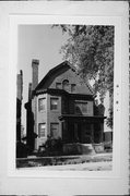 825-827 N CASS ST, a Dutch Colonial Revival house, built in Milwaukee, Wisconsin in 1904.