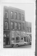 117 E MAIN ST, a Italianate small retail building, built in Madison, Wisconsin in 1875.
