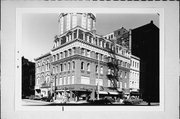 700-02 N MILWAUKEE ST, a Second Empire large retail building, built in Milwaukee, Wisconsin in 1866.