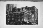 700-02 N MILWAUKEE ST, a Second Empire large retail building, built in Milwaukee, Wisconsin in 1866.