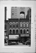 719-723 N MILWAUKEE ST, a Italianate retail building, built in Milwaukee, Wisconsin in 1874.