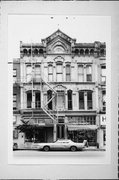 724-728 N MILWAUKEE ST, a Italianate retail building, built in Milwaukee, Wisconsin in 1877.