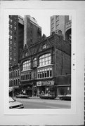 725-729 N MILWAUKEE ST, a Queen Anne retail building, built in Milwaukee, Wisconsin in 1881.