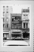 730 N MILWAUKEE ST, a Queen Anne small retail building, built in Milwaukee, Wisconsin in 1877.