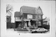 1910-12 E TROWBRIDGE ST, a Dutch Colonial Revival duplex/two-flat, built in Milwaukee, Wisconsin in 1906.