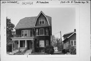 1910-12 E TROWBRIDGE ST, a Dutch Colonial Revival duplex/two-flat, built in Milwaukee, Wisconsin in 1906.