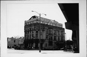 1245 N WATER ST, a Romanesque Revival retail building, built in Milwaukee, Wisconsin in 1890.