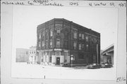 1245 N WATER ST, a Romanesque Revival retail building, built in Milwaukee, Wisconsin in 1890.