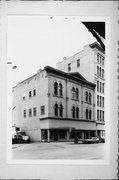 131-137 E WELLS ST, a Italianate retail building, built in Milwaukee, Wisconsin in 1870.