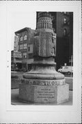 Relocated to Juneau Park (old address: TRIANGLE BOUNDED BY W WELLS ST, N 2ND ST AND N PLANKINTON AVE), a Art Deco commemorative monument/marker, built in Milwaukee, Wisconsin in 1934.