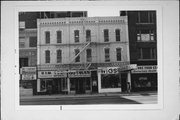 407-413 W WISCONSIN AVE, a Italianate retail building, built in Milwaukee, Wisconsin in 1876.