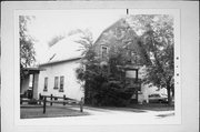 2028-30 S 84TH ST, a Dutch Colonial Revival house, built in West Allis, Wisconsin in 1909.