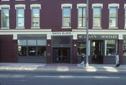 2 S MAIN ST, a Queen Anne retail building, built in Janesville, Wisconsin in 1855.