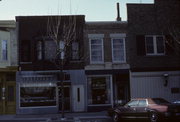 21 N MAIN ST, a Queen Anne retail building, built in Janesville, Wisconsin in 1855.