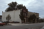 117 N MAIN ST, a Queen Anne retail building, built in Janesville, Wisconsin in 1858.