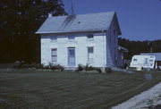 N SIDE OF CREEK RD, OPP 1/4 MIL N OF TRACKS, N TIFFANY, a Greek Revival house, built in La Prairie, Wisconsin in 1846.