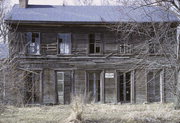 COUNTY HIGHWAY S AT LATHERS RD, 1 MILE SOUTHWEST OF SHOPIERE, a Greek Revival house, built in Turtle, Wisconsin in 1850.