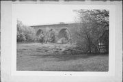 NORTHWESTERN RAILROAD TRACKS OVER TURTLE CREEK, a NA (unknown or not a building) stone arch bridge, built in Turtle, Wisconsin in 1869.