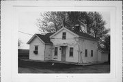 SOUTHEAST CORNER OF COUNTY HIGHWAY X AND J, a Greek Revival house, built in Clinton, Wisconsin in 1850.