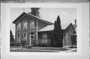 153 S ACADEMY ST, a Gabled Ell house, built in Janesville, Wisconsin in 1865.