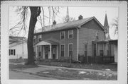 323 S ACADEMY ST, a Greek Revival duplex/two-flat, built in Janesville, Wisconsin in 1865.