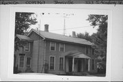 323 S ACADEMY ST, a Greek Revival duplex/two-flat, built in Janesville, Wisconsin in 1865.