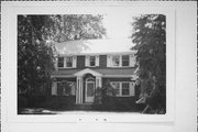 1103 COLUMBUS CIRCLE, a Dutch Colonial Revival house, built in Janesville, Wisconsin in 1927.