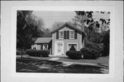 233 S GARFIELD AVE, a Greek Revival house, built in Janesville, Wisconsin in 1865.