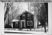 233 S GARFIELD AVE, a Greek Revival house, built in Janesville, Wisconsin in 1865.