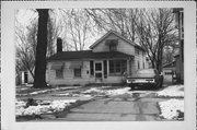 321 S LOCUST ST, a Gabled Ell house, built in Janesville, Wisconsin in 1865.