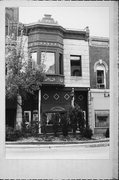 13 N MAIN ST, a Queen Anne retail building, built in Janesville, Wisconsin in 1900.