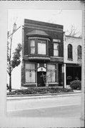 117 N MAIN ST, a Queen Anne retail building, built in Janesville, Wisconsin in 1858.