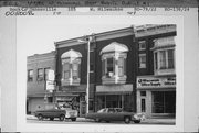 105-107 W MILWAUKEE ST, a Queen Anne retail building, built in Janesville, Wisconsin in 1890.