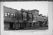 105-107 W MILWAUKEE ST, a Queen Anne retail building, built in Janesville, Wisconsin in 1890.