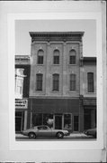 111 W MILWAUKEE ST, a Italianate small retail building, built in Janesville, Wisconsin in 1869.