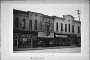117-119 W MILWAUKEE ST, a Commercial Vernacular small retail building, built in Janesville, Wisconsin in 1869.