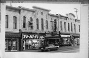 117-119 W MILWAUKEE ST, a Commercial Vernacular small retail building, built in Janesville, Wisconsin in 1869.