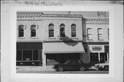 218 W MILWAUKEE ST, a Commercial Vernacular small retail building, built in Janesville, Wisconsin in 1876.