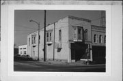 222 W MILWAUKEE ST, a Queen Anne retail building, built in Janesville, Wisconsin in 1875.