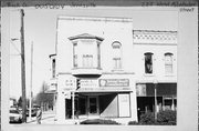 222 W MILWAUKEE ST, a Queen Anne retail building, built in Janesville, Wisconsin in 1875.