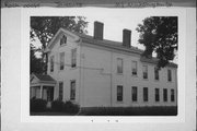 303 N WASHINGTON ST, a Greek Revival house, built in Janesville, Wisconsin in 1853.